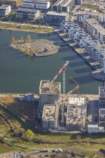 Aerial view, Phoenix-See, construction site for a new retirement home, high-rise building H12, Kulturinsel, Hörde, Dortmund, Ruhr area, North Rhine-Westphalia, Germany, construction work, construction area, construction site, building plots, construction crane, construction project, construction site, DE, Europe, Kulturinsel Phoenix-See, aerial view, aerial photography, aerial photography, new construction, Phoenix Lake, overview, bird's-eye view, former steelworks area Phoenix-Ost, artificial lake, overview