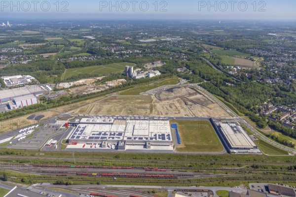 Aerial view, new REWE logistics centre and construction site of the former Westfalenhütte, Borsigplatz, Dortmund, Ruhr area, North Rhine-Westphalia, Germany, construction area, construction site, building plots, construction project, construction site, DE, Europe, commercial enterprises, commercial area, commercial park, commercial location, commercial use, industrial area, industrial building, industrial location, aerial view, aerial photography, aerial photography, overview, bird's-eye view, Westfalenhütte, birds-eyes view, overview