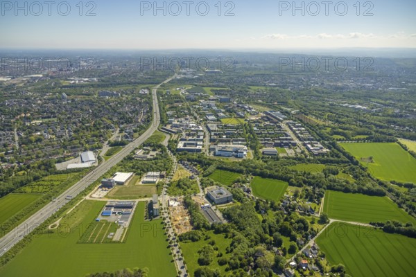 Aerial view, Dortmund University of Technology and Dortmund Technology Park, construction site and new construction Sebrathweg office quarter, A40 motorway, Oespel, Dortmund, Ruhr area, North Rhine-Westphalia, Germany, construction work, construction area, construction site, building plots, construction measure, row of trees, construction project, construction site, DE, Europe, commercial enterprises, commercial area, commercial area, commercial site, commercial use, university, industrial area, industrial site, aerial view, aerial photography, aerial photography, new building, TU Dortmund, Dortmund University of Technology, technology centre, overview, bird's-eye view, birds-eyes view, overview