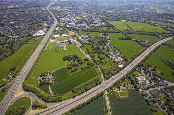 Aerial view, Dortmund University of Technology and Dortmund Technology Park, construction site and new construction Sebrathweg office quarter, A40 motorway, Oespel, Dortmund, Ruhr area, North Rhine-Westphalia, Germany, construction work, construction area, construction site, building plots, construction measure, row of trees, construction project, construction site, DE, Europe, commercial enterprises, commercial area, commercial area, commercial site, commercial use, university, industrial area, industrial site, aerial view, aerial photography, aerial photography, new building, TU Dortmund, Dortmund University of Technology, technology centre, overview, bird's-eye view, birds-eyes view, overview