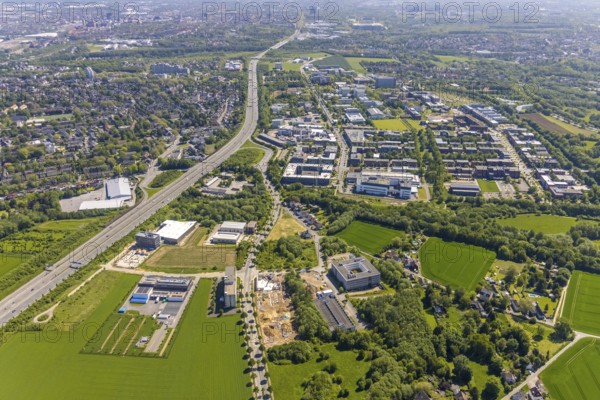 Aerial view, Dortmund University of Technology and Dortmund Technology Park, construction site and new construction Sebrathweg office quarter, A40 motorway, Oespel, Dortmund, Ruhr area, North Rhine-Westphalia, Germany, construction work, construction area, construction site, building plots, construction measure, row of trees, construction project, construction site, DE, Europe, commercial enterprises, commercial area, commercial area, commercial site, commercial use, university, industrial area, industrial site, aerial view, aerial photography, aerial photography, new building, TU Dortmund, Dortmund University of Technology, technology centre, overview, bird's-eye view, birds-eyes view, overview