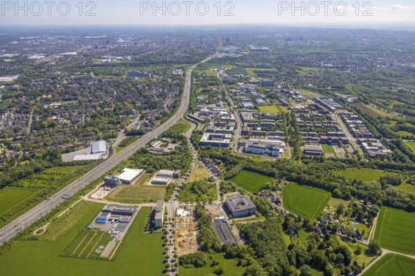 Aerial view, Dortmund University of Technology and Dortmund Technology Park, construction site and new construction Sebrathweg office quarter, A40 motorway, Oespel, Dortmund, Ruhr area, North Rhine-Westphalia, Germany, construction work, construction area, construction site, building plots, construction project, construction site, DE, Emil-Figge-Straße, Europe, commercial enterprises, commercial area, commercial area, commercial location, commercial use, university, industrial area, industrial location, aerial view, aerial photography, aerial photography, new building, TU Dortmund, Dortmund University of Technology, technology centre, overview, bird's-eye view, birds-eyes view, overview