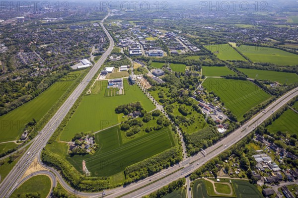 Aerial view, Dortmund University of Technology and Dortmund Technology Park, construction site and new construction Sebrathweg office quarter, A40 motorway, Oespel, Dortmund, Ruhr area, North Rhine-Westphalia, Germany, construction work, construction area, construction site, building plots, construction measure, row of trees, construction project, construction site, DE, Europe, commercial enterprises, commercial area, commercial area, commercial site, commercial use, university, industrial area, industrial site, aerial view, aerial photography, aerial photography, new building, TU Dortmund, Dortmund University of Technology, technology centre, overview, bird's-eye view, birds-eyes view, overview