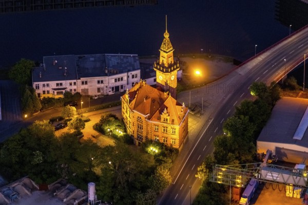 Aerial view, night view of Dortmund harbour, historic building old harbour office, coal port of the inland portDortmunder Hafen AG in Dortmund in the federal state of North Rhine-Westphalia, Germany, Dortmund, Ruhr area, North Rhine-Westphalia, DE, Europe, birds-eyes view, aerial view, aerial photography, aerial photography, overview, overview, bird's eye view, night flight, night shot, nightshot, twilight, inland port, inland port, Dortmund-Ems Canal, Speicherstraße