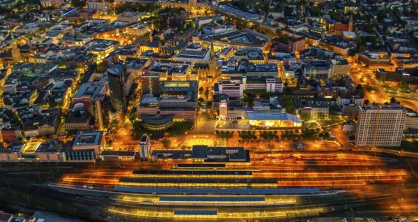 Aerial view, Dortmund main station and city centre, Harenberg City-Center, RWE Tower, German Football Museum, City, Dortmund, Ruhr area, North Rhine-Westphalia, Germany, railway station, station forecourt, DE, Deutsche Bahn AG, twilight photography, Europe, football, HCC Dortmund, Harenberg Kommunikation Verlags- u. Medien GmbH, central station, main station, light pollution, aerial view, aerial photography, aerial photography, museum, night, night shot, night flight, Dortmund City and State Library, overview, bird's-eye view, illuminated streets, birds-eyes view, nightflight, overview