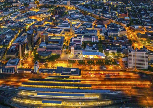 Aerial view, Dortmund main station and city centre, Harenberg City-Center, RWE Tower, German Football Museum, City, Dortmund, Ruhr area, North Rhine-Westphalia, Germany, railway station, station forecourt, DE, Deutsche Bahn AG, twilight photography, Europe, football, HCC Dortmund, Harenberg Kommunikation Verlags- u. Medien GmbH, central station, main station, light pollution, aerial view, aerial photography, aerial photography, museum, night, night shot, night flight, Dortmund City and State Library, overview, bird's-eye view, illuminated streets, birds-eyes view, nightflight, overview