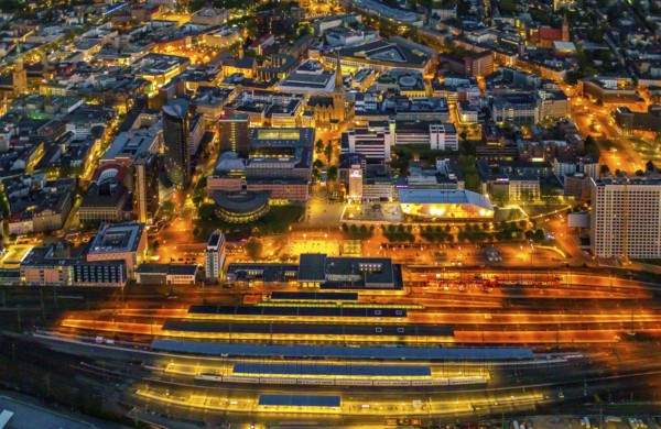 Aerial view, Dortmund main station and city centre, Harenberg City-Center, RWE Tower, German Football Museum, City, Dortmund, Ruhr area, North Rhine-Westphalia, Germany, railway station, station forecourt, DE, Deutsche Bahn AG, twilight photography, Europe, football, HCC Dortmund, Harenberg Kommunikation Verlags- u. Medien GmbH, central station, main station, light pollution, aerial view, aerial photography, aerial photography, museum, night, night shot, night flight, Dortmund City and State Library, overview, bird's-eye view, illuminated streets, birds-eyes view, nightflight, overview