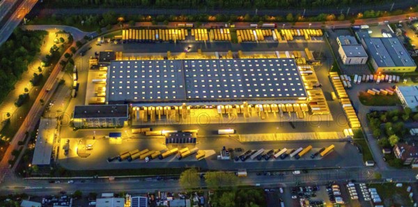 Aerial photography, Dachser SE, freight forwarding service, Dorstfelder Brücke, Dortmund, Ruhr area, North Rhine-Westphalia, Germany, DE, twilight photography, Europe, commercial enterprises, commercial area, commercial location, commercial use, freight traffic, industrial area, industrial location, light pollution, logistics, logistics service, logistics service provider, logistics provider, logistics centre, aerial photography, aerial photography, night, night photography, night flight, forwarding, transport, transport service, overview, bird's-eye view, illuminated streets, birds-eyes view, nightflight, overview