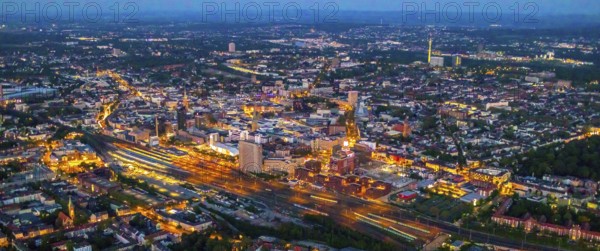 Aerial view, Dortmund main station and city centre, Dortmund U-Tower, city, Dortmund, Ruhr area, North Rhine-Westphalia, Germany, railway station, DE, Deutsche Bahn AG, twilight photography, Europe, main station, central station, culture, light pollution, aerial photography, aerial photography, aerial photography, night, night photography, night flight, overview, events, venue, event location, event centre, bird's eye view, illuminated streets, birds-eyes view, cultural use, nightflight, overview