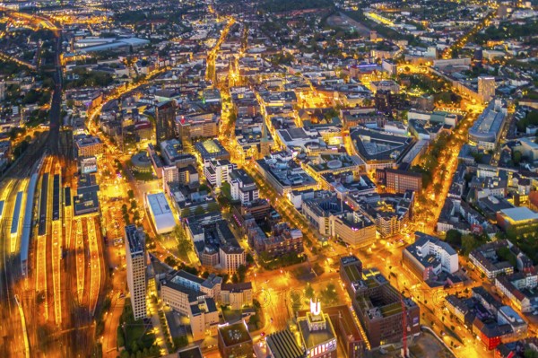 Aerial view, Dortmund main station and city centre, Harenberg City-Center, RWE Tower, German Football Museum, City, Dortmund, Ruhr area, North Rhine-Westphalia, Germany, railway station, station forecourt, DE, Deutsche Bahn AG, twilight photography, Europe, football, HCC Dortmund, Harenberg Kommunikation Verlags- u. Medien GmbH, central station, main station, light pollution, aerial view, aerial photography, aerial photography, museum, night, night shot, night flight, Dortmund City and State Library, overview, bird's-eye view, illuminated streets, birds-eyes view, nightflight, overview