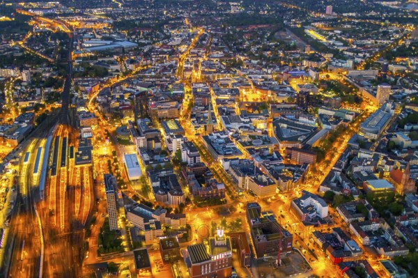 Aerial view, Dortmund main station and city centre, Harenberg City-Center, RWE Tower, German Football Museum, City, Dortmund, Ruhr area, North Rhine-Westphalia, Germany, railway station, station forecourt, DE, Deutsche Bahn AG, twilight photography, Europe, football, HCC Dortmund, Harenberg Kommunikation Verlags- u. Medien GmbH, central station, main station, light pollution, aerial view, aerial photography, aerial photography, museum, night, night shot, night flight, Dortmund City and State Library, overview, bird's-eye view, illuminated streets, birds-eyes view, nightflight, overview