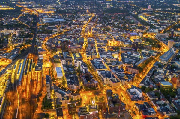Aerial view, Dortmund main station and city centre, Harenberg City-Center, RWE Tower, German Football Museum, City, Dortmund, Ruhr area, North Rhine-Westphalia, Germany, railway station, station forecourt, DE, Deutsche Bahn AG, twilight photography, Europe, football, HCC Dortmund, Harenberg Kommunikation Verlags- u. Medien GmbH, central station, main station, light pollution, aerial view, aerial photography, aerial photography, museum, night, night shot, night flight, Dortmund City and State Library, overview, bird's-eye view, illuminated streets, birds-eyes view, nightflight, overview