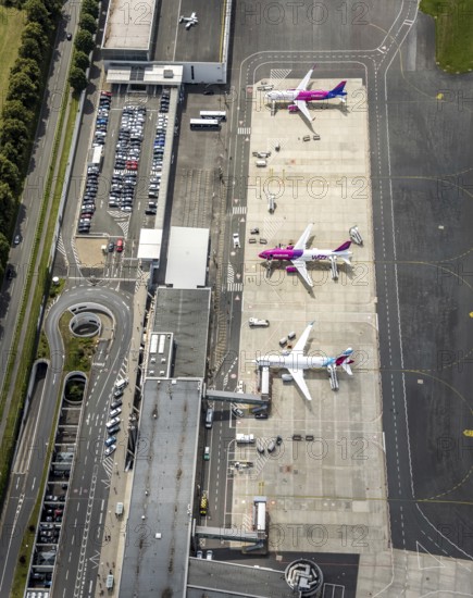 Aerial photo, Dortmund Airport, EDLW, Wickede, apron with two Wizzair jets and a Eurowings plane, Dortmund, Ruhr area, North Rhine-Westphalia, Germany, Europe, birds-eyes view, aerial photo, aerial photography, aerial photography, overview, bird's eye view