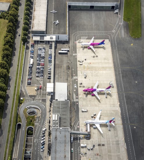 Aerial photo, Dortmund Airport, EDLW, Wickede, apron with two Wizzair jets and a Eurowings aircraft, Dortmund, Ruhr area, North Rhine-Westphalia, Germany, DE, Europe, birds-eyes view, aerial photography, aerial photography, overview, bird's eye view