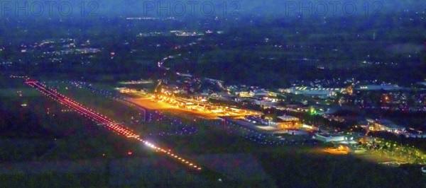 Aerial photo, Dortmund Airport, DTM, Wickede, Dortmund, Ruhr area, North Rhine-Westphalia, Germany, terminal building, DE, Dortmund Airport DTM, twilight photography, reception building, Europe, flight emission, airport, aircraft noise, airfield, runway, light pollution, aerial photograph, aerial photography, aerial photography, night, night photography, night flight, runway, overview, bird's-eye view, illuminated streets, birds-eyes view, nightflight, overview
