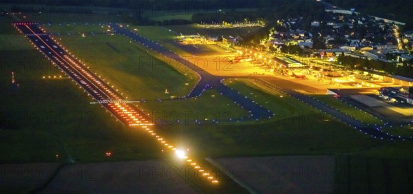 Aerial photo, Dortmund Airport, DTM, Wickede, Dortmund, Ruhr area, North Rhine-Westphalia, Germany, terminal building, DE, Dortmund Airport DTM, twilight photography, reception building, Europe, flight emission, airport, aircraft noise, airfield, runway, light pollution, aerial photograph, aerial photography, aerial photography, night, night photography, night flight, runway, overview, bird's-eye view, illuminated streets, birds-eyes view, nightflight, overview