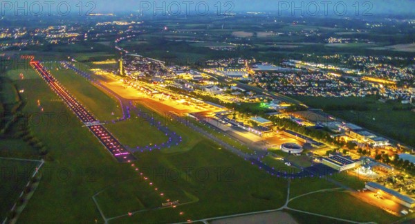 Aerial photo, Dortmund Airport, DTM, Wickede, Dortmund, Ruhr area, North Rhine-Westphalia, Germany, terminal building, DE, Dortmund Airport DTM, twilight photography, reception building, Europe, flight emission, airport, aircraft noise, airfield, runway, light pollution, aerial photograph, aerial photography, aerial photography, night, night photography, night flight, runway, overview, bird's-eye view, illuminated streets, birds-eyes view, nightflight, overview