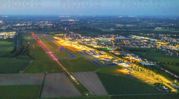Aerial photo, Dortmund Airport, DTM, Wickede, Dortmund, Ruhr area, North Rhine-Westphalia, Germany, terminal building, DE, Dortmund Airport DTM, twilight photography, reception building, Europe, flight emission, airport, aircraft noise, airfield, runway, light pollution, aerial photograph, aerial photography, aerial photography, night, night photography, night flight, runway, overview, bird's-eye view, illuminated streets, birds-eyes view, nightflight, overview