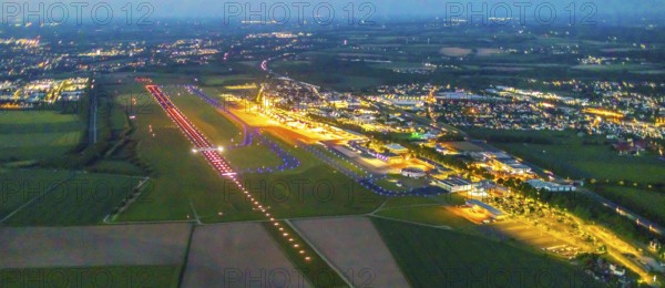 Aerial photo, Dortmund Airport, DTM, Wickede, Dortmund, Ruhr area, North Rhine-Westphalia, Germany, terminal building, DE, Dortmund Airport DTM, twilight photography, reception building, Europe, flight emission, airport, aircraft noise, airfield, runway, light pollution, aerial photograph, aerial photography, aerial photography, night, night photography, night flight, runway, overview, bird's-eye view, illuminated streets, birds-eyes view, nightflight, overview