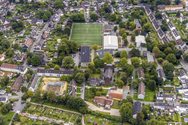 Aerial view, St. Charles Borromeo Catholic Church and Am Wasserfall sports ground in the Dorstfeld district of Dortmund, Ruhr area, North Rhine-Westphalia, Germany, place of worship, DE, Dortmund, Europe, football pitch, religious community, place of worship, holy site, church, parish, denomination, aerial photograph, aerial photography, aerial photography, religion, religious site, sport, sports facilities, sports ground, sports venue, overview, bird's eye view, bird's eye view, overview