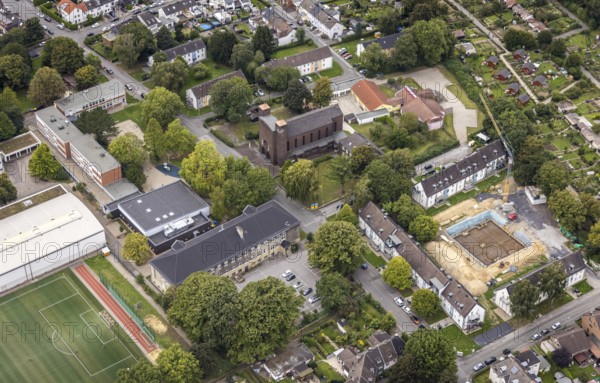 Aerial view, St. Charles Borromeo Catholic Church and Martin Luther King Comprehensive School in the Dorstfeld district of Dortmund, Ruhr area, North Rhine-Westphalia, Germany, place of worship, education, educational institution, DE, Dortmund, Europe, comprehensive school, religious community, place of worship, holy place, church, parish, denomination, educational institute, aerial view, aerial photography, aerial photography, religion, religious site, school, overview, bird's eye view, birds-eyes view, overview