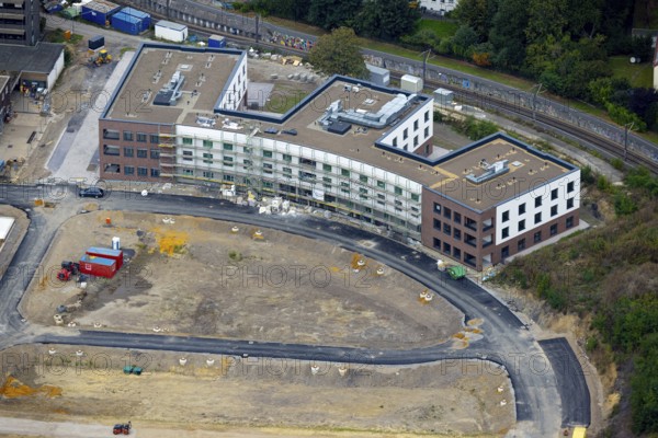 Aerial view, construction site Hombrucher Bogen for commercial areas and multi-family houses in the district Hombruch in Dortmund, Ruhr area, North Rhine-Westphalia, Germany, construction work, construction area, construction site, building plots, construction project, construction site, DE, Dortmund, Europe, aerial view, aerial photography, aerial photography, new building, snow, overview, bird's eye view, colliery square, birds-eyes view, former prefabricated concrete plant at Luisenglück, overview