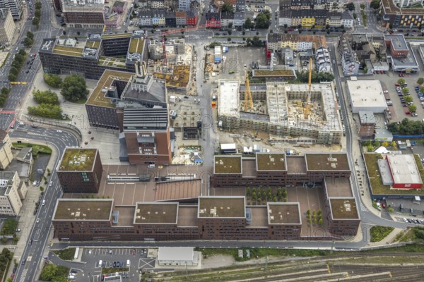 Aerial view, construction site and new construction of a residential complex at the Dortmund U-Tower with the Ostwall Museum and Leisure Centre West in the Dorstfelder Brücke district in Dortmund, Ruhr area, North Rhine-Westphalia, Germany, construction work, building, construction area, building site, building plots, construction crane, construction project, construction project, construction site, DE, Dortmund, Dortmunder U Centre for Art and Creativity, Emil-Moog-Platz, Europe, FZW, aerial view, aerial photography, aerial photography, new building, Robert-Bosch-Berufskolleg, overview, bird's-eye view, Centre for Art and Creativity, birds-eyes view, overview