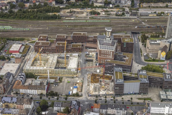 Aerial view, construction site and new construction of a residential complex at the Dortmund U-Tower with the Ostwall Museum and Leisure Centre West in the Dorstfelder Brücke district in Dortmund, Ruhr area, North Rhine-Westphalia, Germany, construction work, building, construction area, building site, building plots, construction crane, construction project, construction project, construction site, DE, Dortmund, Dortmunder U Centre for Art and Creativity, Emil-Moog-Platz, Europe, FZW, aerial view, aerial photography, aerial photography, new building, Robert-Bosch-Berufskolleg, overview, bird's-eye view, Centre for Art and Creativity, birds-eyes view, overview