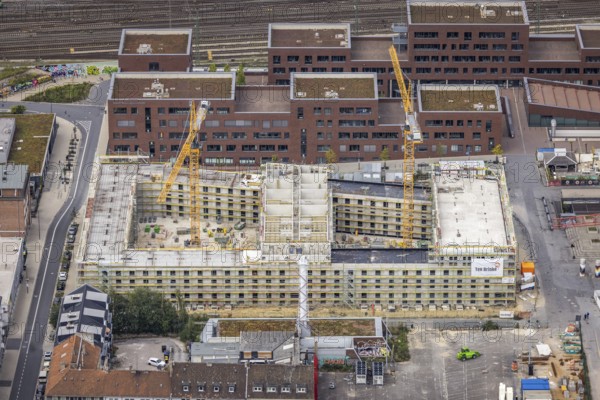 Aerial view, construction site and new construction of a residential complex at the Dortmund U-Tower with the Ostwall Museum and Leisure Centre West in the Dorstfelder Brücke district in Dortmund, Ruhr area, North Rhine-Westphalia, Germany, construction work, building, construction area, building site, building plots, construction crane, construction project, construction project, construction site, DE, Dortmund, Dortmunder U Centre for Art and Creativity, Emil-Moog-Platz, Europe, FZW, aerial view, aerial photography, aerial photography, new building, Robert-Bosch-Berufskolleg, overview, bird's-eye view, Centre for Art and Creativity, birds-eyes view, overview