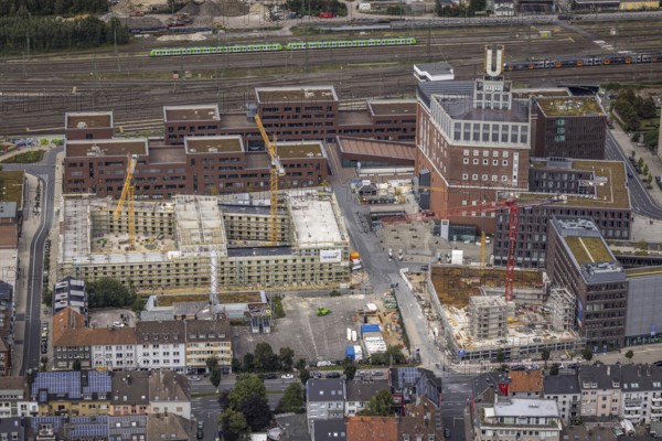 Aerial view, construction site and new construction of a residential complex at the Dortmund U-Tower with the Ostwall Museum and Leisure Centre West in the Dorstfelder Brücke district in Dortmund, Ruhr area, North Rhine-Westphalia, Germany, construction work, building, construction area, building site, building plots, construction crane, construction project, construction project, construction site, DE, Dortmund, Dortmunder U Centre for Art and Creativity, Emil-Moog-Platz, Europe, FZW, aerial view, aerial photography, aerial photography, new building, Robert-Bosch-Berufskolleg, overview, bird's-eye view, Centre for Art and Creativity, birds-eyes view, overview