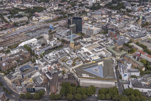 Aerial view, city centre with Thier Galerie, evangelic church St. Petri, central station Dortmund and black RWE Tower. Petri, Dortmund central station and black RWE Tower in the city district of Dortmund, Ruhr area, North Rhine-Westphalia, Germany, place of worship, railway station, DE, Deutsche Bahn AG, Dortmund, shopping centre, shopping mile, shopping square, shopping mall, Europe, religious community, place of worship, central station, main station, holy place, church, church community, denomination, aerial view, aerial photography, aerial photography, religion, religious site, shopping, shopping centre, overview, bird's eye view, birds-eyes view, overview