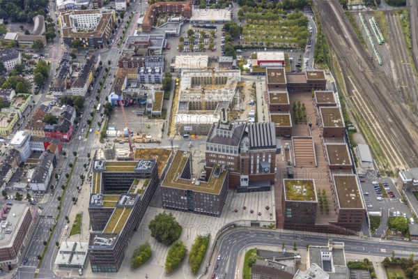 Aerial view, construction site and new construction of a residential complex at the Dortmund U-Tower with the Ostwall Museum and Leisure Centre West in the district Dorstfelder Brücke in Dortmund, Ruhr area, North Rhine-Westphalia, Germany, construction work, building, construction area, building site, building plots, building crane, construction project, construction project, construction site, DE, Dortmund, Dortmunder U Centre for Art and Creativity, Emil-Moog-Platz, Europe, FZW, aerial view, aerial photography, aerial photography, new building, Robert-Bosch-Berufskolleg, overview, bird's-eye view, Centre for Art and Creativity, birds-eyes view, overview
