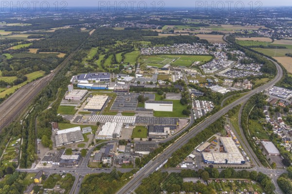 Aerial view, commercial area Heßlingsweg and BVB Borussia Dortmund training ground at Adi-Preißler-Allee in the district Brackel in Dortmund, Ruhr area, North Rhine-Westphalia, Germany, BVB 09 Borussia Dortmund, DE, Dortmund, Europe, football ground, commercial enterprises, commercial area, commercial area, commercial park, commercial location, commercial use, industrial area, industrial building, industrial location, aerial view, aerial photography, aerial photography, sports facilities, sports field, sports facility, training, overview, bird's eye view, birds-eyes view, overview