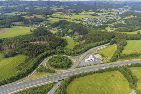 Aerial view, motorway junction Drolshagen, motorway A45 with petrol station and roundabout, Germinghausen, Drolshagen, Sauerland, North Rhine-Westphalia, Germany, motorway A45, DE, Europe, shapes and colours, aerial view, aerial photography, aerial photography, overview, bird's-eye view, overview
