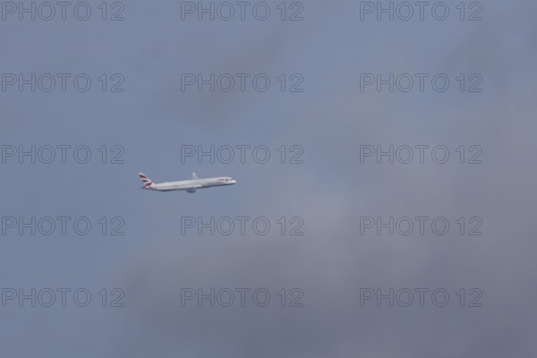Boeing 787-9 Dreamliner jet passenger aircraft of British Airways airlines in flight in a blue sky, London, England, United Kingdom