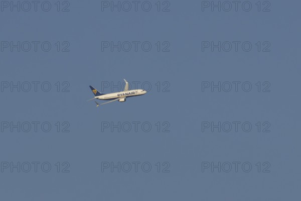 Boeing 737 jet passenger aircraft of Ryanair airlines in flight in a blue sky, Rome, Italy