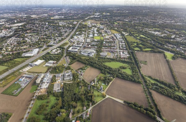 Technical University Dortmund Campus North and construction sites Im Weißen Feld at Brennaborstraße and Sebrathweg in the district Oespel in Dortmund, Ruhr area, North Rhine-Westphalia, Germany, motorway A40, construction work, construction area, construction site, building plots, construction project, Campus North, DE, Dortmund, Europe, distant view, green area technology park, aerial view, aerial photograph, aerial photography, aerial photography, new building, Sebrathweg, TU Dortmund, Dortmund University of Technology, overview, University of Dortmund, Verizon Germany, bird's-eye view, Weißes Feld, birds-eyes view, overview