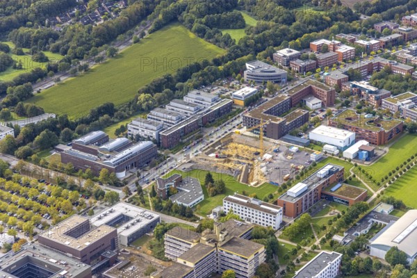 Aerial view of the TZDO - TechnologieZentrumDortmund GmbH, Technical University of Dortmund with the BioMedicine Centre BMZ and Max Planck Institute of Molecular Physiology as well as the construction site for the CALEDO research centre next to the Faculty of Computer Science on Otto-cock-Straße in the Eichlinghofen district of Dortmund, Ruhr area, North Rhine-Westphalia, Germany, construction work, construction area, building site, building plots, construction project, building site, Campus North, Center for Advanced Liquid-Phase Engineering Dortmund (CALEDO), DE, Dortmund, Europe, aerial view, aerial photography, aerial photography, new building, TU Dortmund, Technical University Dortmund, overview, bird's-eye view, overview
