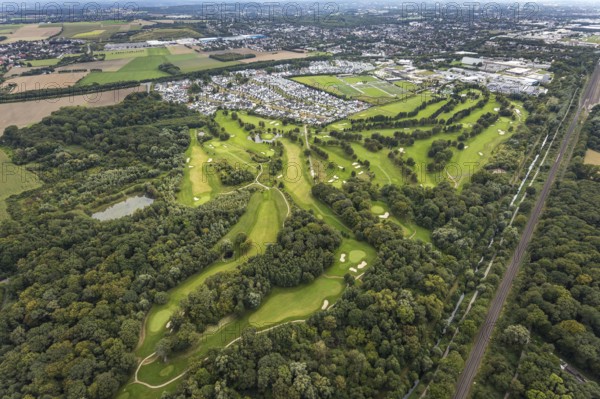 Aerial view, Royal Saint Barbara's Dortmund Golf Club and single-family house housing estate Brackeler Feld and BVB Borussia Dortmund training ground in the district Brackel in Dortmund, Ruhr area, North Rhine-Westphalia, Germany, DE, Dortmund, single-family houses, Europe, football pitch, golf, golf course, golf club, golf course, golf meadow, property tax, real estate, aerial view, aerial photography, aerial photography, sports, sports facilities, sports field, sports facility, overview, bird's eye view, residential area, residential area, residential buildings, residential quality, residential neighbourhood, housing estate, birds-eyes view, overview