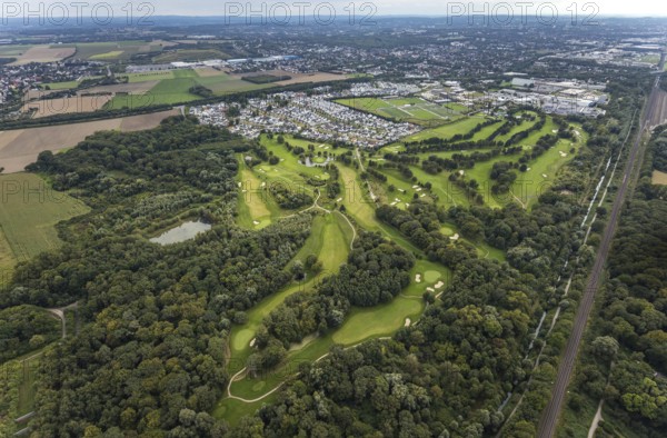 Aerial view, Royal Saint Barbara's Dortmund Golf Club and single-family house housing estate Brackeler Feld and BVB Borussia Dortmund training ground in the district Brackel in Dortmund, Ruhr area, North Rhine-Westphalia, Germany, DE, Dortmund, single-family houses, Europe, football pitch, golf, golf course, golf club, golf course, golf meadow, property tax, real estate, aerial view, aerial photography, aerial photography, sports, sports facilities, sports field, sports facility, overview, bird's eye view, residential area, residential area, residential buildings, residential quality, residential neighbourhood, housing estate, birds-eyes view, overview