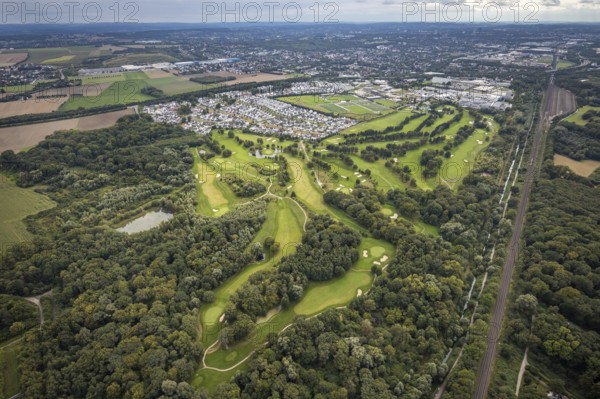 Aerial view, Royal Saint Barbara's Dortmund Golf Club and single-family house housing estate Brackeler Feld and BVB Borussia Dortmund training ground in the district Brackel in Dortmund, Ruhr area, North Rhine-Westphalia, Germany, DE, Dortmund, single-family houses, Europe, football pitch, golf, golf course, golf club, golf course, golf meadow, property tax, real estate, aerial view, aerial photography, aerial photography, sports, sports facilities, sports field, sports facility, overview, bird's eye view, residential area, residential area, residential buildings, residential quality, residential neighbourhood, housing estate, birds-eyes view, overview