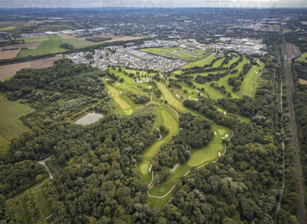 Aerial view, Royal Saint Barbara's Dortmund Golf Club and single-family house housing estate Brackeler Feld and BVB Borussia Dortmund training ground in the district Brackel in Dortmund, Ruhr area, North Rhine-Westphalia, Germany, DE, Dortmund, single-family houses, Europe, football pitch, golf, golf course, golf club, golf course, golf meadow, property tax, real estate, aerial view, aerial photography, aerial photography, sports, sports facilities, sports field, sports facility, overview, bird's eye view, residential area, residential area, residential buildings, residential quality, residential neighbourhood, housing estate, birds-eyes view, overview