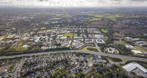 Aerial view of the TZDO - TechnologieZentrumDortmund GmbH, Technical University Dortmund Campus North with the Technology Centre and EMC Test North Rhine-Westphalia GmbH EMC Competence Centre as well as construction site for the CALEDO research centre next to the Faculty of Computer Science in the Oespel district of Dortmund, Ruhr area, North Rhine-Westphalia, Germany, A40 motorway, construction work, construction site, building plots, construction avenue, construction measure, construction project, construction site, education, educational institution, north campus, south campus, DE, Dortmund, Elmos Semiconductor SE, Emil-Figge-Straße, Europe, distant view, green area technology park, aerial view, aerial photograph, aerial photography, aerial photography, new building, TU Dortmund, Dortmund University of Technology, overview, University of Dortmund, bird's-eye view, overview
