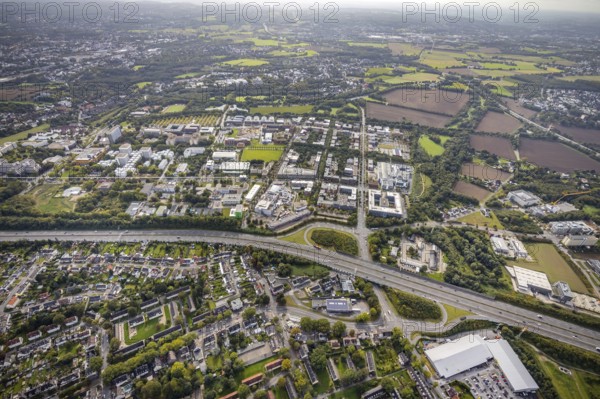 Aerial view of the TZDO - TechnologieZentrumDortmund GmbH, Technical University Dortmund Campus North with the Technology Centre and EMC Test North Rhine-Westphalia GmbH EMC Competence Centre as well as construction site for the CALEDO research centre next to the Faculty of Computer Science in the Oespel district of Dortmund, Ruhr area, North Rhine-Westphalia, Germany, A40 motorway, construction work, construction site, building plots, construction avenue, construction measure, construction project, construction site, education, educational institution, north campus, south campus, DE, Dortmund, Elmos Semiconductor SE, Emil-Figge-Straße, Europe, distant view, green area technology park, aerial view, aerial photograph, aerial photography, aerial photography, new building, TU Dortmund, Dortmund University of Technology, overview, University of Dortmund, bird's-eye view, overview
