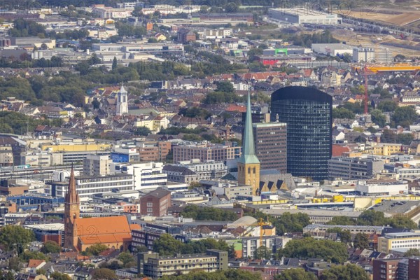 View of the city centre with the Church of Our Lady of the Holy Sepulchre, the Protestant Church of St. Peter, the Sparkasse Tower and the RWE Tower. Petri, Sparkassenhochhaus and RWE Tower in the City district of Dortmund, Ruhr area, North Rhine-Westphalia, Germany, place of worship, office tower, City, DE, Dortmund, Europe, religious community, place of worship, holy place, high-rise building, city centre, church, parish, denomination, RWE Vertrieb AG headquarters, aerial view, aerial photograph, aerial photography, aerial photography, local view, Petrikirche, RWE Tower, religion, religious site, skyline, townscape, city centre, overview, bird's-eye view, overview