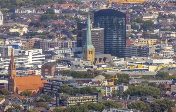 View of the city centre with the Church of Our Lady of the Holy Sepulchre, the Protestant Church of St. Peter, the Sparkasse Tower and the RWE Tower. Petri, Sparkassenhochhaus and RWE Tower in the City district of Dortmund, Ruhr area, North Rhine-Westphalia, Germany, place of worship, office tower, City, DE, Dortmund, Europe, religious community, place of worship, holy place, high-rise building, city centre, church, parish, denomination, RWE Vertrieb AG headquarters, aerial view, aerial photograph, aerial photography, aerial photography, local view, Petrikirche, RWE Tower, religion, religious site, skyline, townscape, city centre, overview, bird's-eye view, overview
