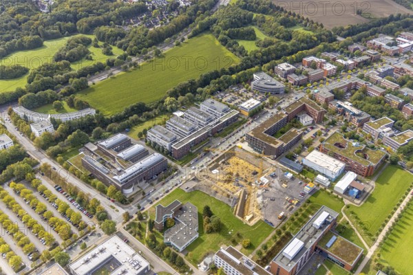 Aerial view of the TZDO - TechnologieZentrumDortmund GmbH, Technical University of Dortmund with the BioMedicine Centre BMZ and the Max Planck Institute of Molecular Physiology as well as the construction site for the CALEDO research centre next to the Faculty of Computer Science on Otto-cock-Straße in the Eichlinghofen district of Dortmund, Ruhr area, North Rhine-Westphalia, Germany, construction work, construction area, building site, building plots, construction project, building site, Campus North, Center for Advanced Liquid-Phase Engineering Dortmund (CALEDO), DE, Dortmund, Europe, aerial view, aerial photography, aerial photography, new building, TU Dortmund, Technical University Dortmund, overview, bird's-eye view, overview