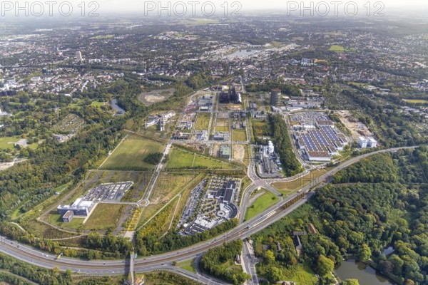 Phönix-West area and Hoesch-Gasometer with the Phoenix Lake in the background as well as Wilo Park, BMW branch Dortmund, INTECH Die Industrieausrüster and Amprion GmbH Stromversorger in the district Hörde in Dortmund, Ruhr area, North Rhine-Westphalia, Germany, Amprion GmbH Stromversorger, DE, monument protection, Dortmund, Europe, commercial enterprises, commercial area, commercial park, commercial location, commercial use, industrial area, industrial building, industrial location, innovation location, aerial view, aerial photograph, aerial photography, aerial photography, Phoenix-See, Phoenix-West, overview, bird's-eye view, birds-eyes view, former blast furnace plant, overview