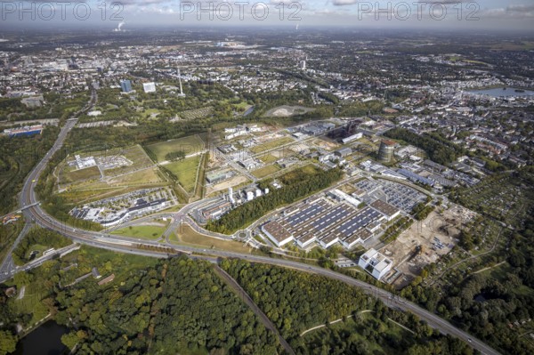 Phönix-West area and Hoesch-Gasometer with the Phoenix Lake in the background as well as Wilo Park, BMW branch Dortmund, INTECH Die Industrieausrüster and Amprion GmbH Stromversorger in the district Hörde in Dortmund, Ruhr area, North Rhine-Westphalia, Germany, Amprion GmbH Stromversorger, DE, monument protection, Dortmund, Europe, commercial enterprises, commercial area, commercial park, commercial location, commercial use, industrial area, industrial building, industrial location, innovation location, aerial view, aerial photograph, aerial photography, aerial photography, Phönix-West, overview, bird's-eye view, birds-eyes view, former blast furnace plant, overview