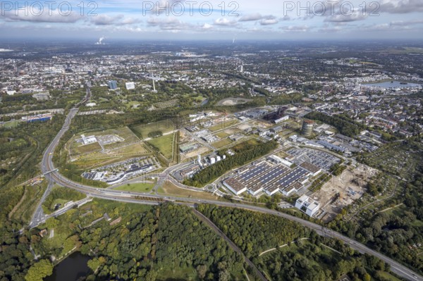 Phönix-West area and Hoesch-Gasometer with the Phoenix Lake in the background as well as Wilo Park, BMW branch Dortmund, INTECH Die Industrieausrüster and Amprion GmbH Stromversorger in the district Hörde in Dortmund, Ruhr area, North Rhine-Westphalia, Germany, Amprion GmbH Stromversorger, DE, monument protection, Dortmund, Europe, commercial enterprises, commercial area, commercial park, commercial location, commercial use, industrial area, industrial building, industrial location, innovation location, aerial view, aerial photograph, aerial photography, aerial photography, Phönix-West, overview, bird's-eye view, birds-eyes view, former blast furnace plant, overview